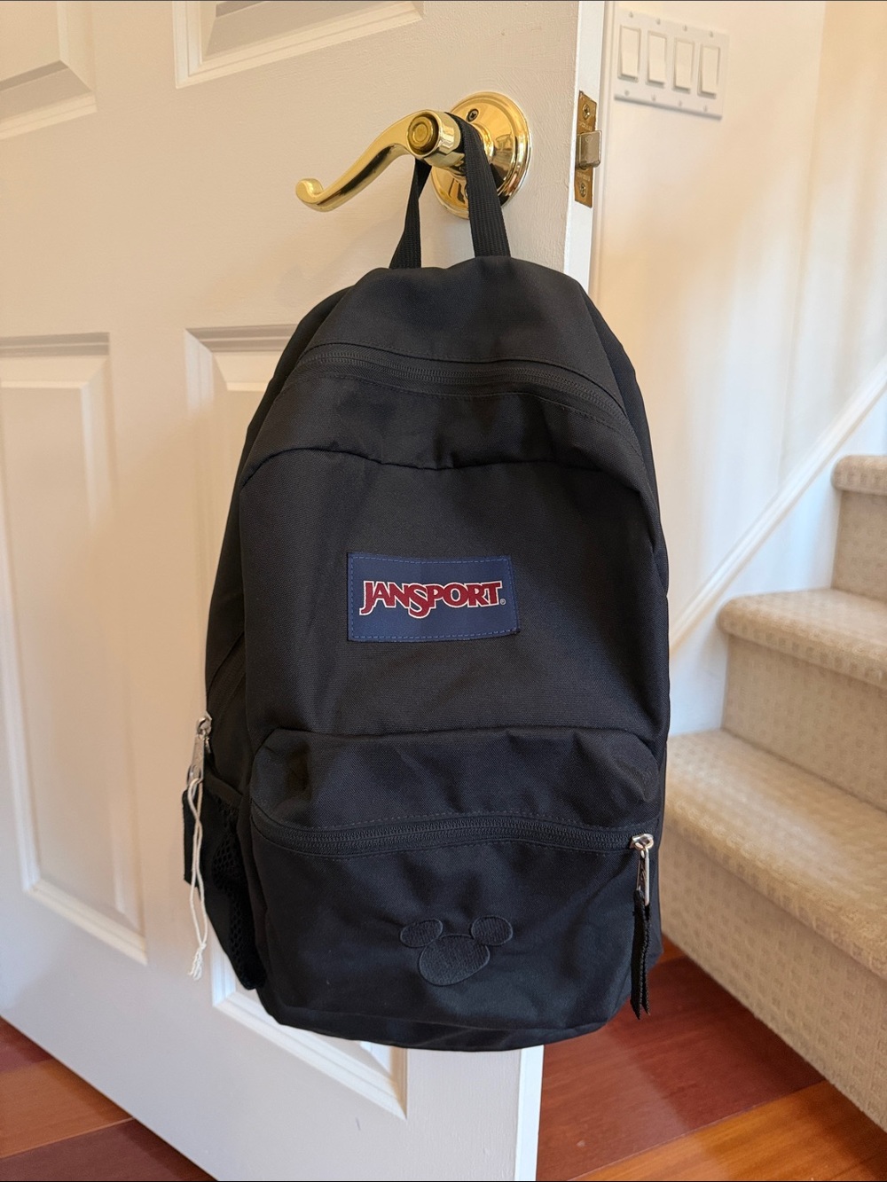 Jansport Black Everyday Backpack with Disney Mickey Ears black logo